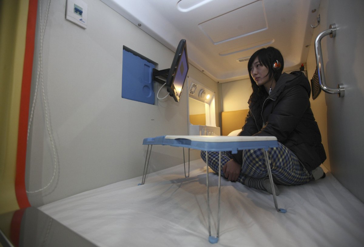 a-capsule-hotel-in-china-within-the-city-of-qingdao-packs-an-lcd-tv-into-each-of-its-2-by-1-meter-spaces