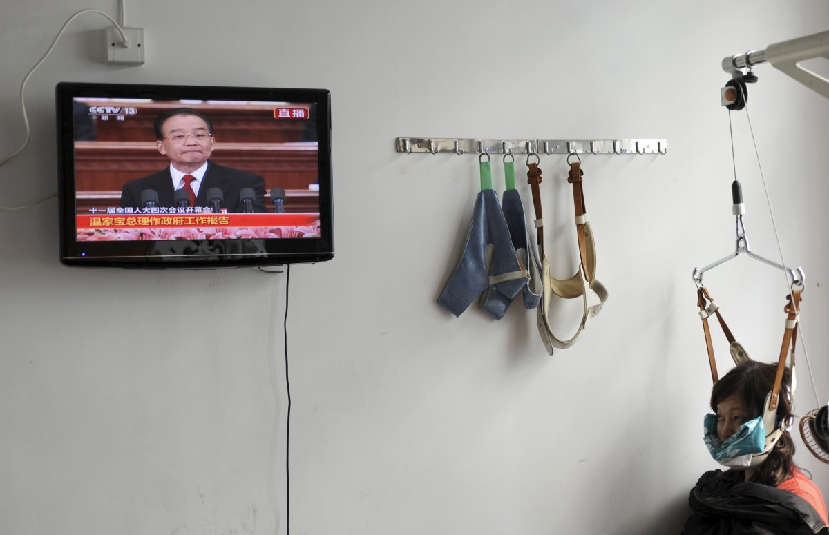 a-patient-watches-a-televised-government-broadcast-while-receiving-medical-treatment-at-a-chinese-hospital-in-jiaxing