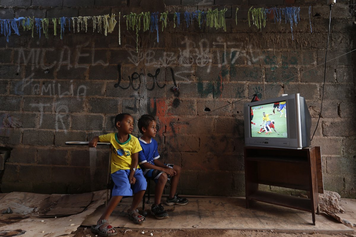 during-the-world-cup-a-couple-of-young-boys-on-the-outskirts-of-brasilia-watch-as-their-home-team-brazil-plays-against-mexico