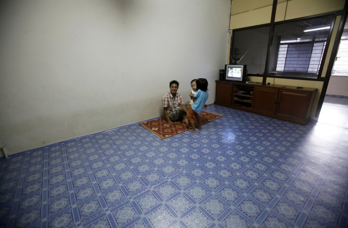 within-kuala-lumpur-the-capital-of-malaysia-a-myanmar-refugee-family-sits-in-the-lounge-of-their-empty-apartment