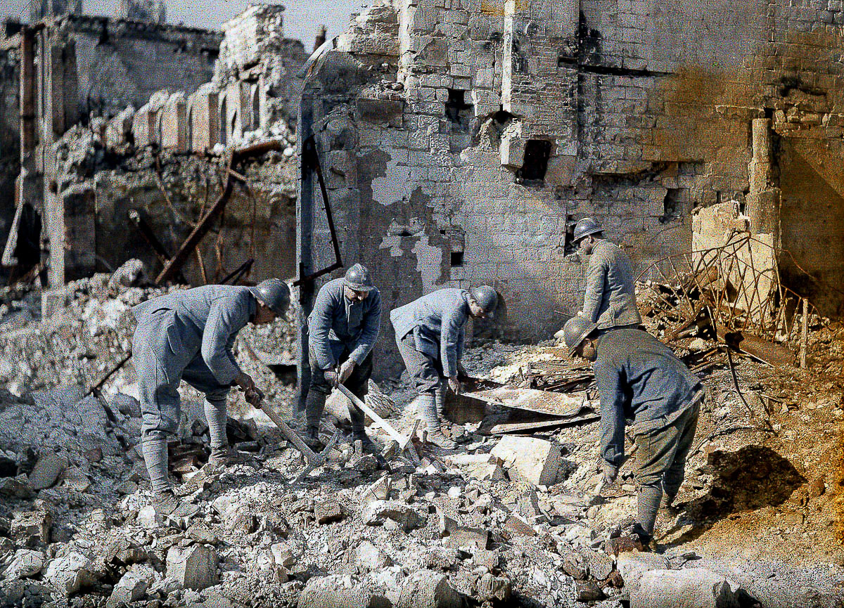 Five French soldiers are clearing the rubble in the ruins of Reims, which was destroyed almost 60 per cent by German artillery and air raids during World War I. 1917. Color photo (Autochrome Lumière) by Fernand Cuville (1887-1927). Western Front. Reims, France. (Photo by Galerie Bilderwelt/Getty Images)