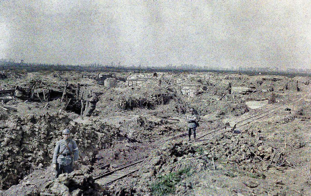 Two French soldiers are standing at a narrow gauge railroad track near the French line at Het Sas in an area that has been devastated by artillery fire. 10th September 1917. The battle ground is near the village of Boezinge, north of the city of Ypres in West Flanders. Western Front. World War I. Autochrome LumiËre. Photo: Paul Castelnau (1880-1944). Belgium.† (Photo by Galerie Bilderwelt/Getty Images)