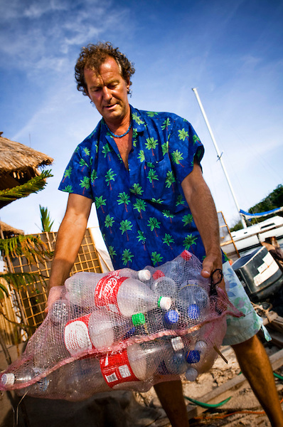 The New Spiral Island A bag of plastic bottles that will be pushed under the island to keep it floating. British environmentalist and eco-pioneer Richart "Rishie" Sowa, who believes in recycling and low-impact living, has built his own floating island in a lagoon by Isla Mujeres, Mexico. The island is built on over 100 000 plastic bottles and is about 20m in diameter. It has beaches, a house where Sowa lives, 2 ponds, a solar-powered waterfall/river, and solar panels. Mangroves, palmtrees and other plants are growing on it. This is the second Island Sowa has built; The first was destroyed in a hurricane in 2005.